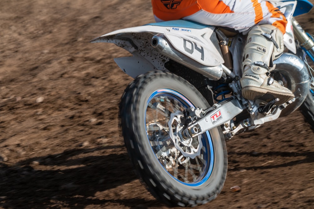 a person riding a motorcycle on a dirt track