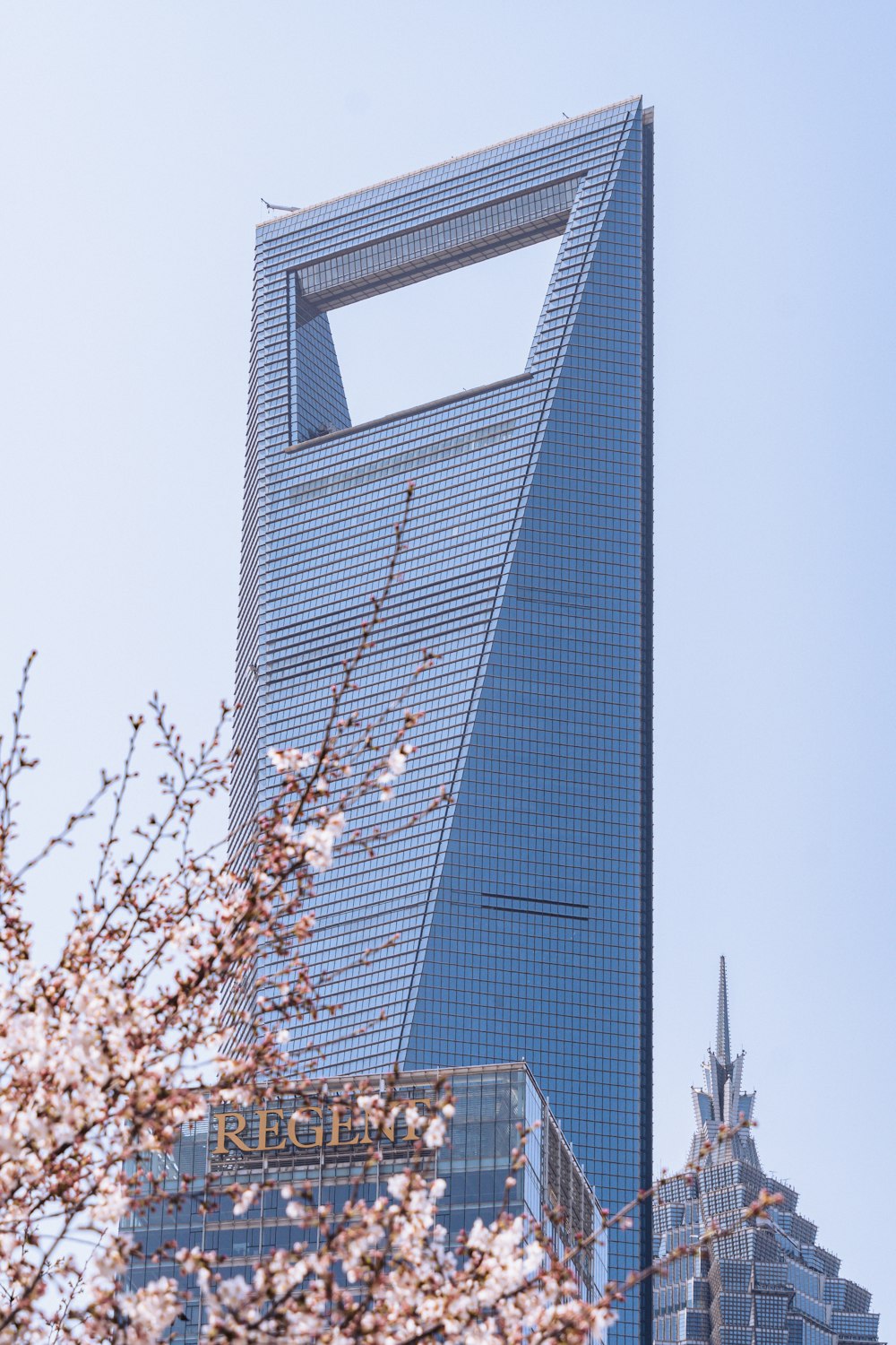 a tall building with a sky scraper in the middle of it