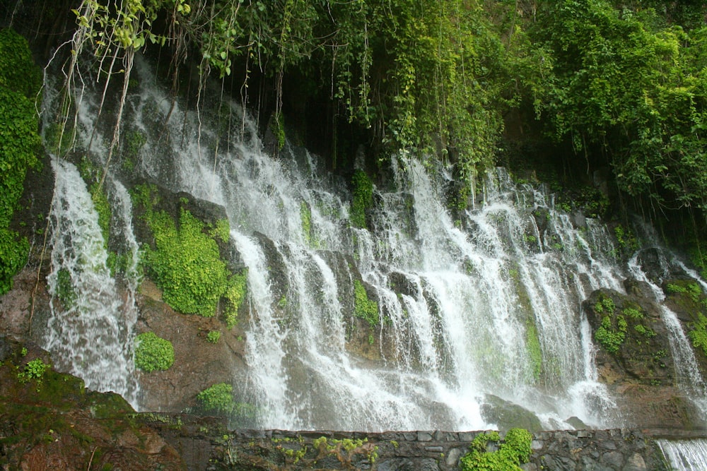 a large waterfall with lots of water coming out of it