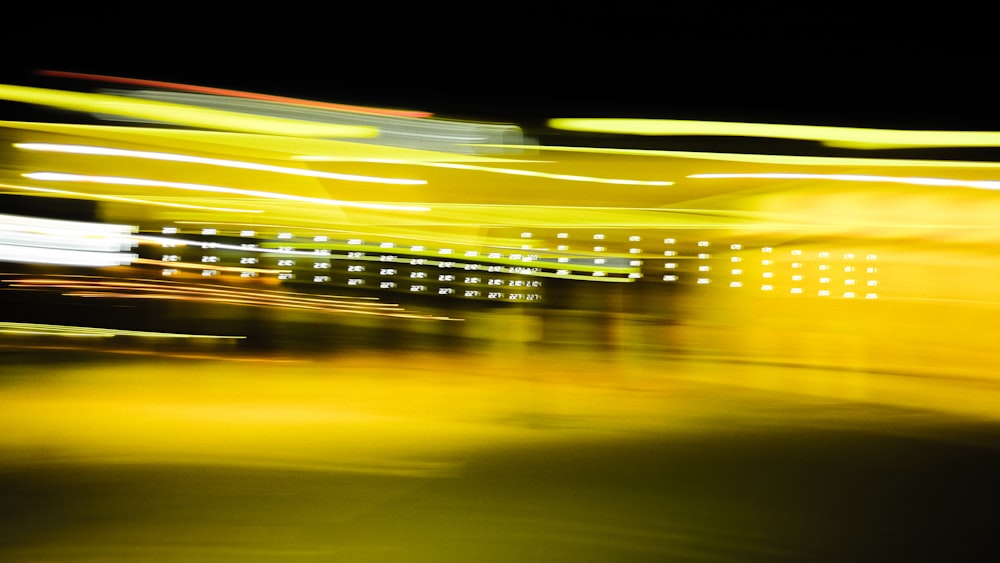 a blurry photo of a city street at night