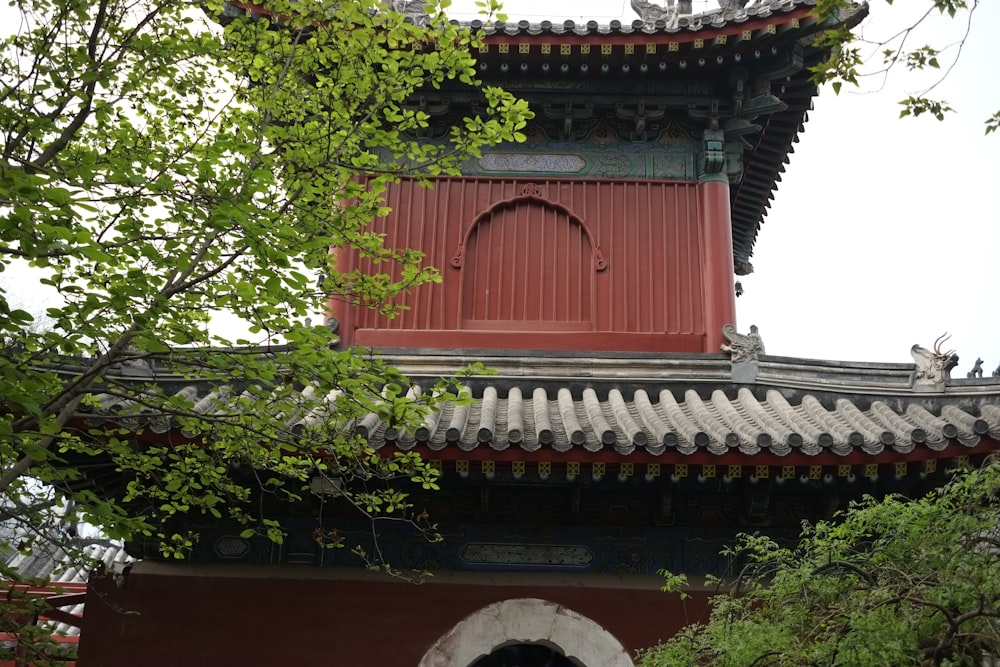 a building with a red roof and a white door