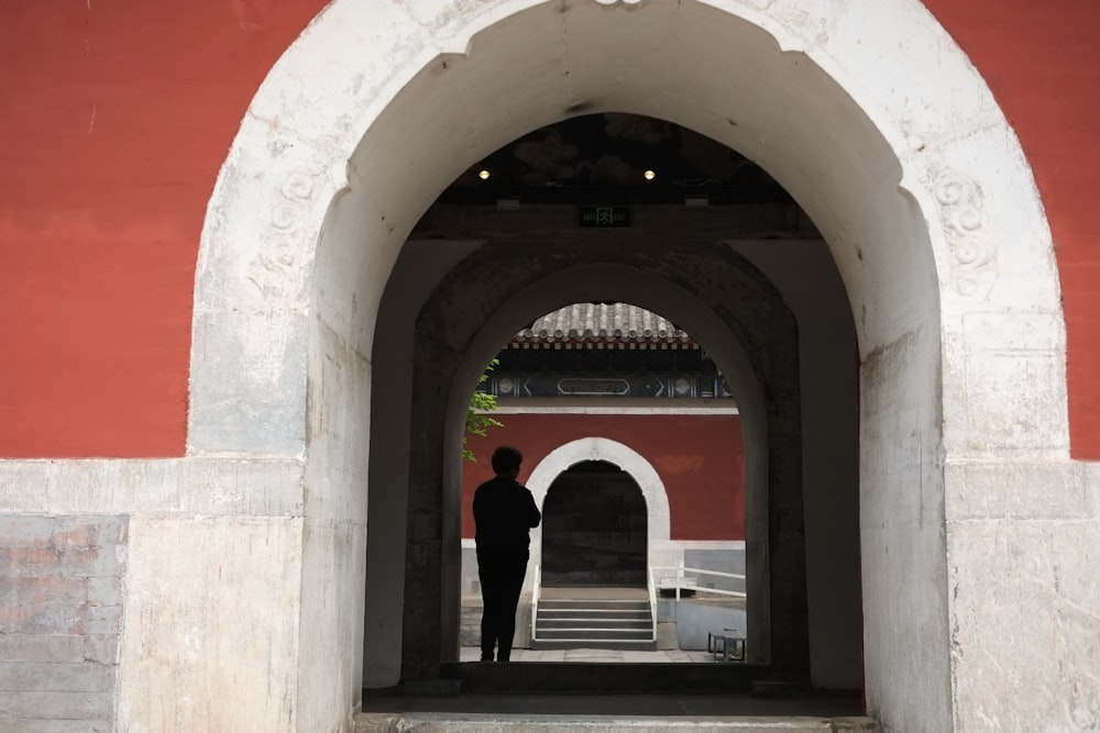 a man standing in a doorway of a building