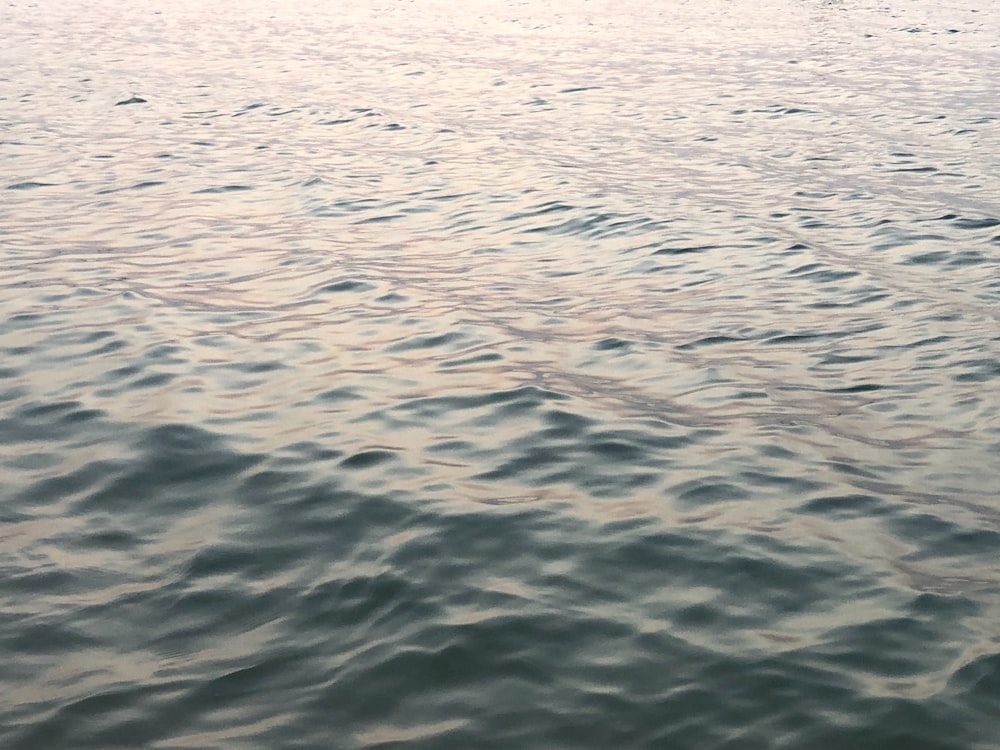 a boat floating on top of a large body of water