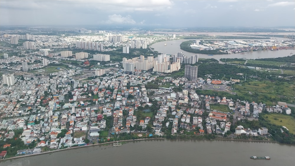 an aerial view of a city and a body of water