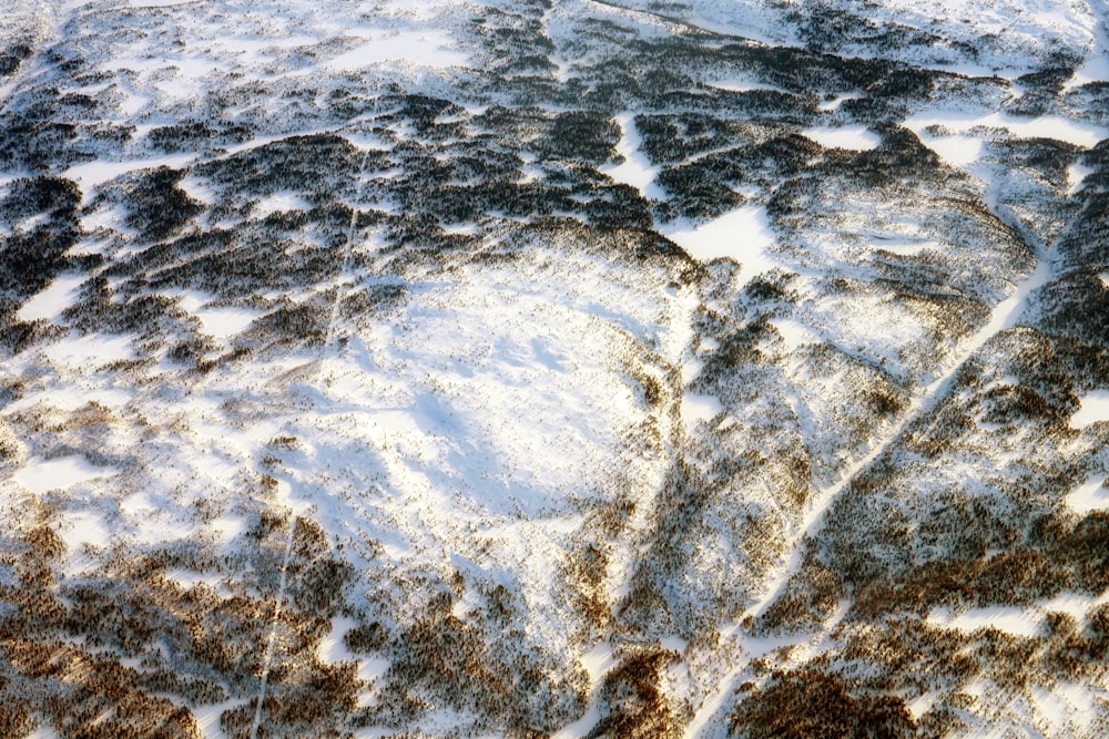 an aerial view of a snow covered mountain