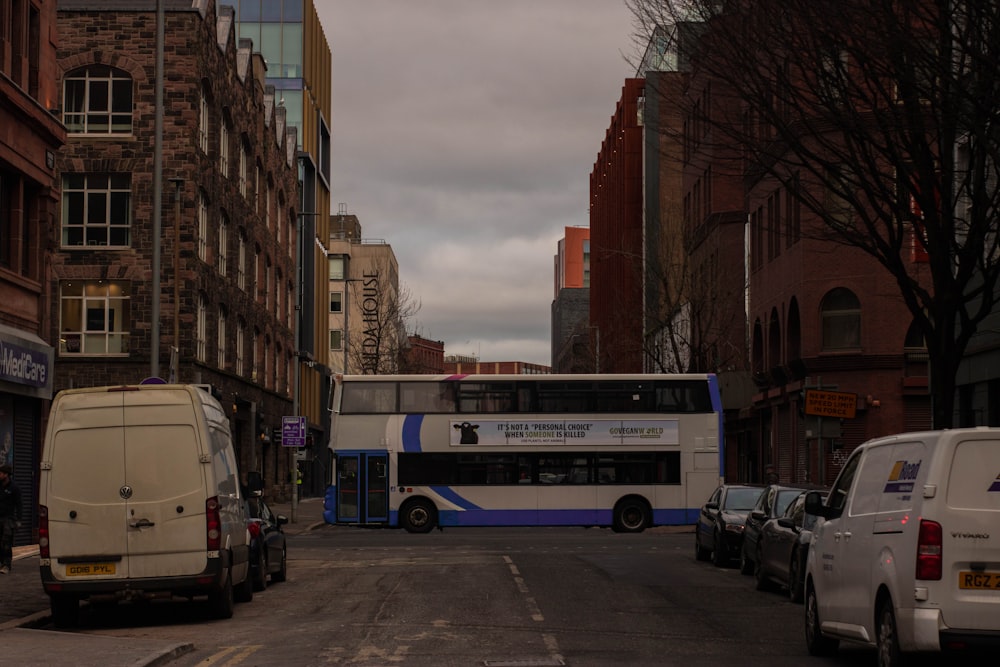 a double decker bus driving down a city street