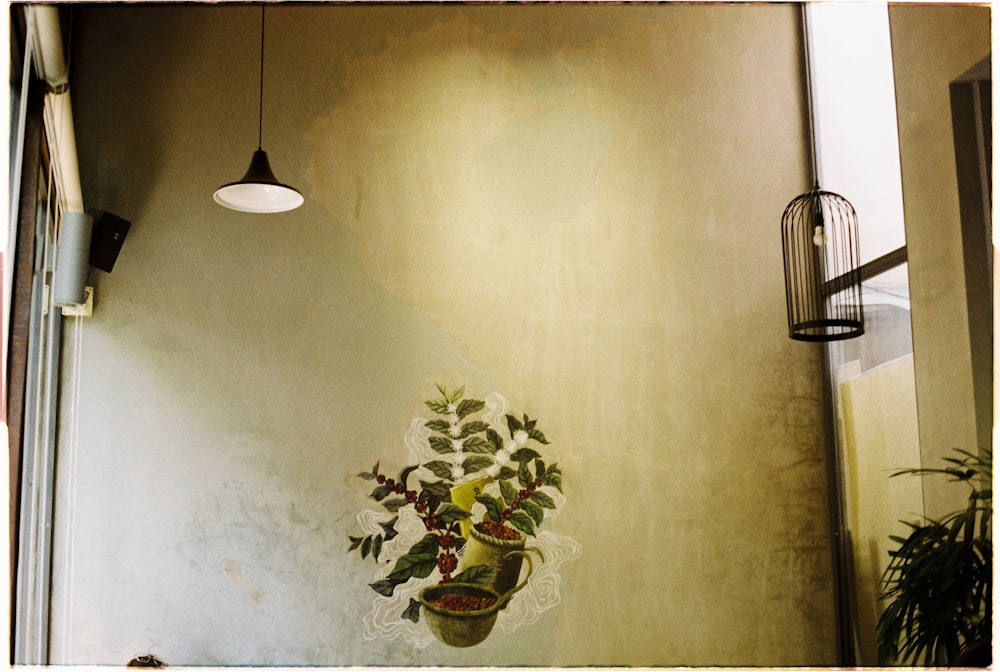 a vase of flowers on a wall in a room