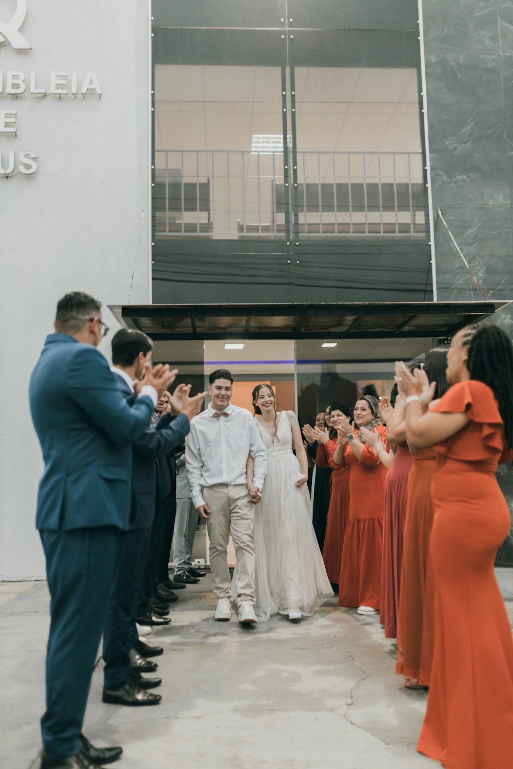 a group of people standing outside of a building