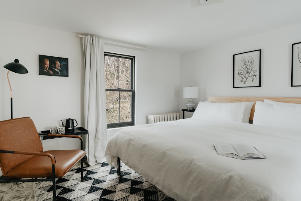 a bedroom with a checkered floor and a white bed