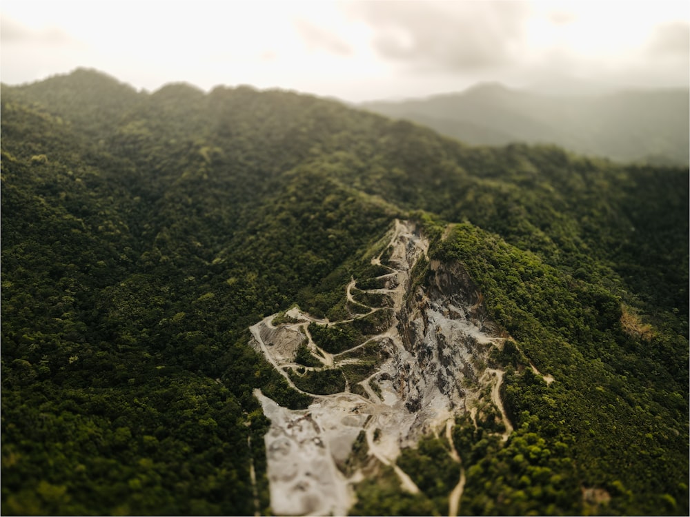 an aerial view of a mountain with a river running through it