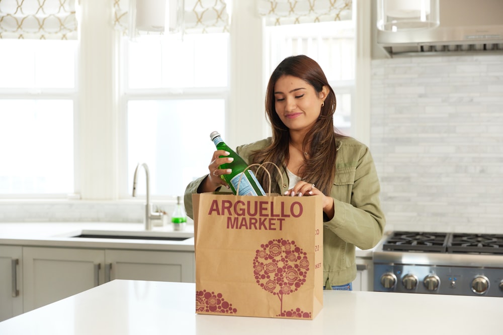 woman unpacking groceries from local market