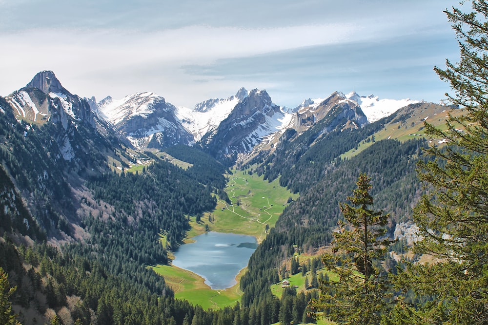 a view of a mountain range with a lake in the middle