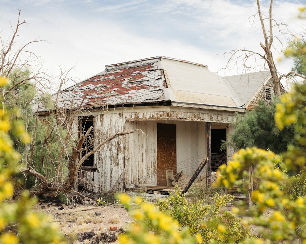 an old run down house in the middle of nowhere