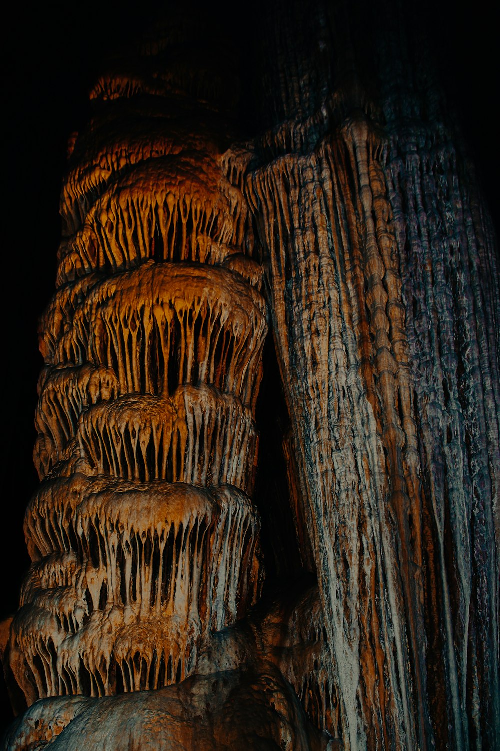 a group of large rocks covered in lots of stalate