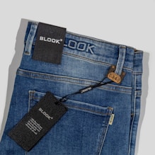 a close up of a pair of jeans with a tag on it