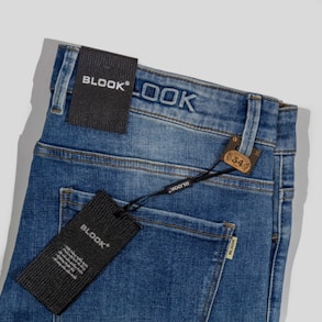 a close up of a pair of jeans with a tag on it