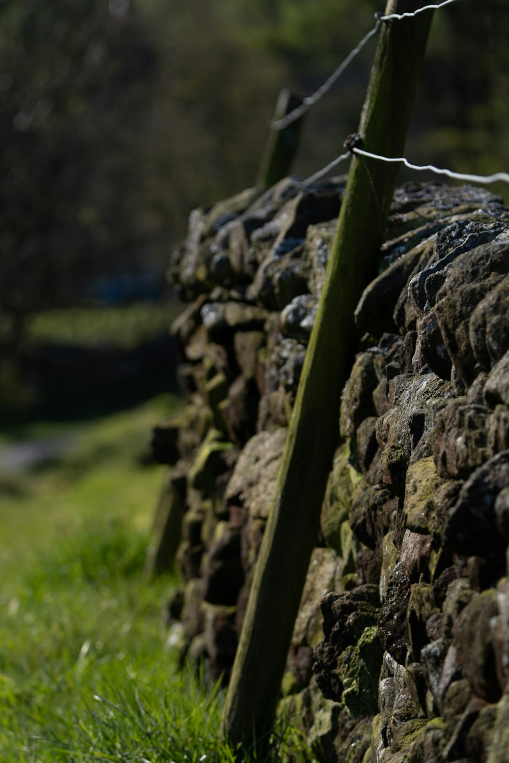 a close up of a fence made of rocks