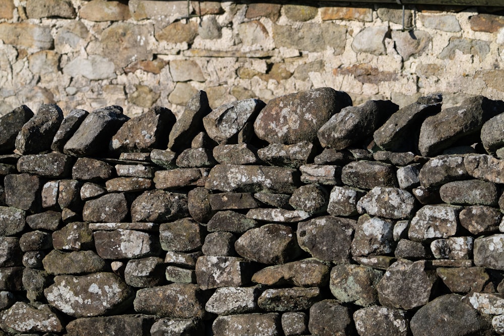 a close up of a stone wall made of rocks