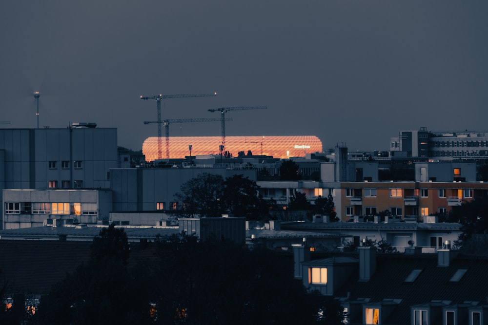 a view of a city at night with a building under construction