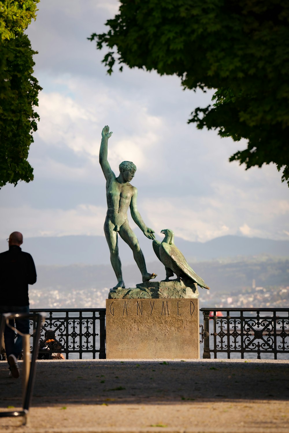 a statue of a man with a bird on his arm