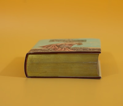 a book sitting on top of a yellow table