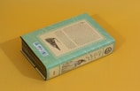 a book sitting on top of a yellow table