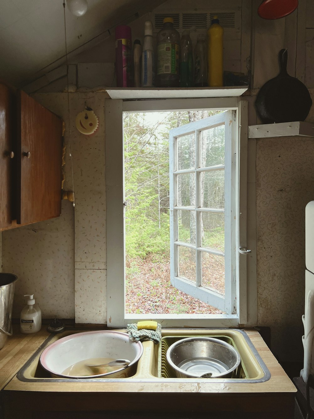 a kitchen with a sink and a window