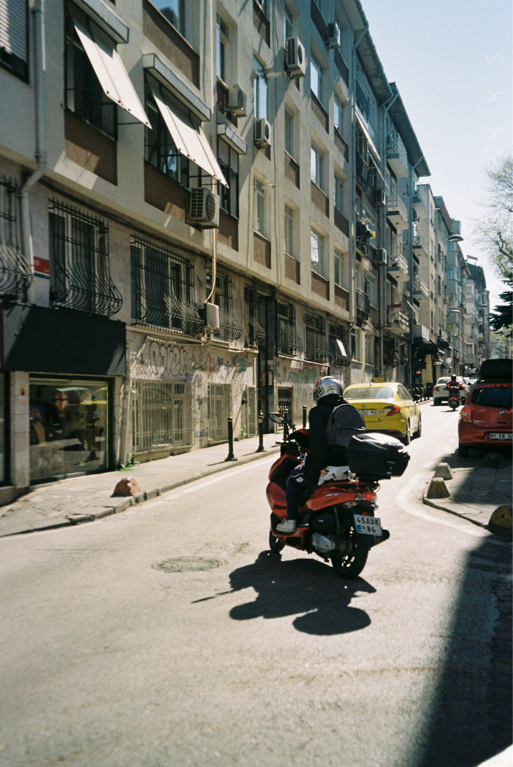 a person riding a motorcycle on a city street