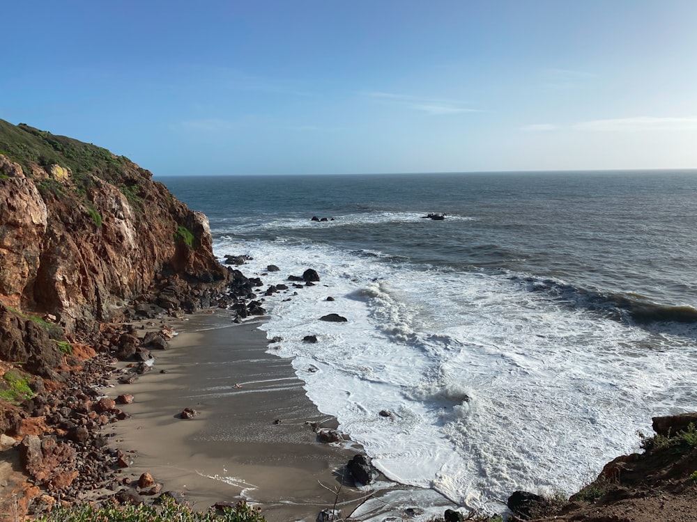 a view of the ocean from the top of a cliff