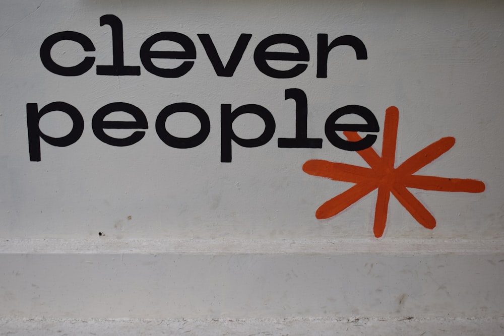 a sign that says clever people on it
