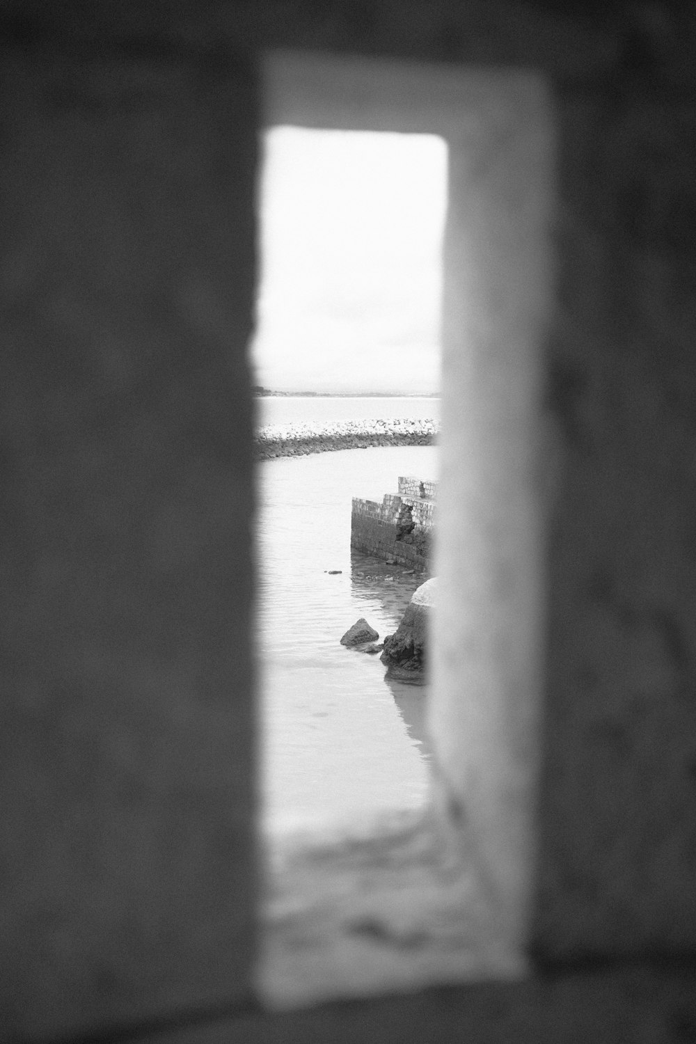 a black and white photo of a boat in the water