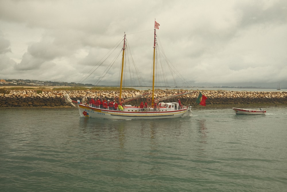 a boat with people on it in the water