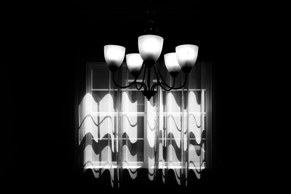 a black and white photo of a chandelier