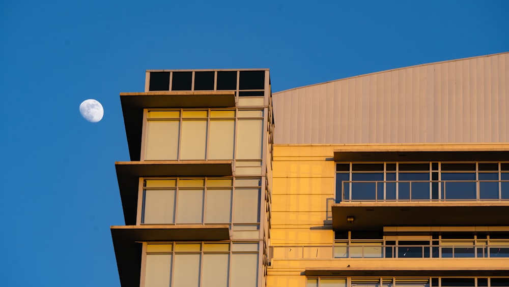 a building with a half moon in the sky