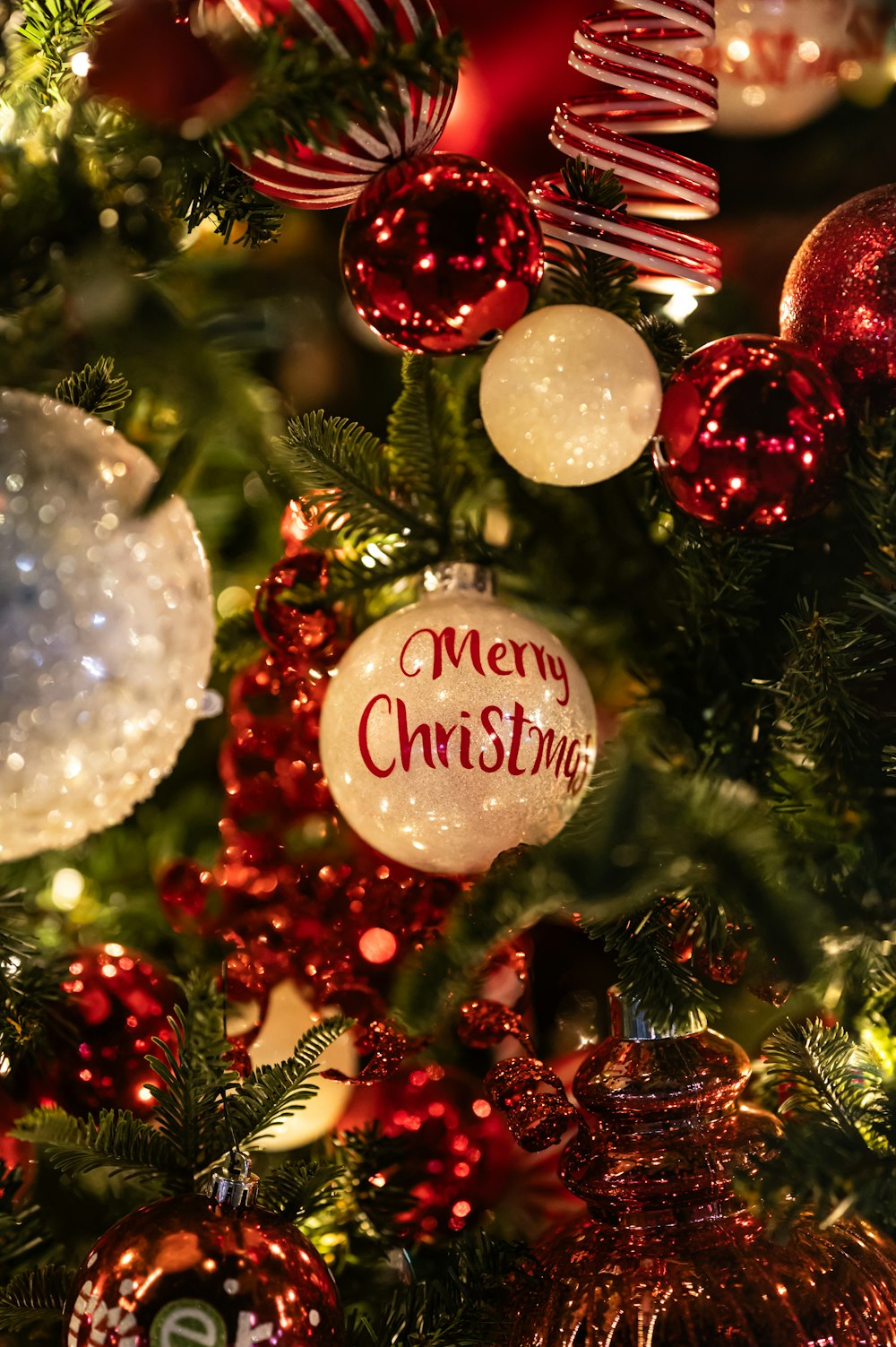 a close up of a christmas tree with ornaments