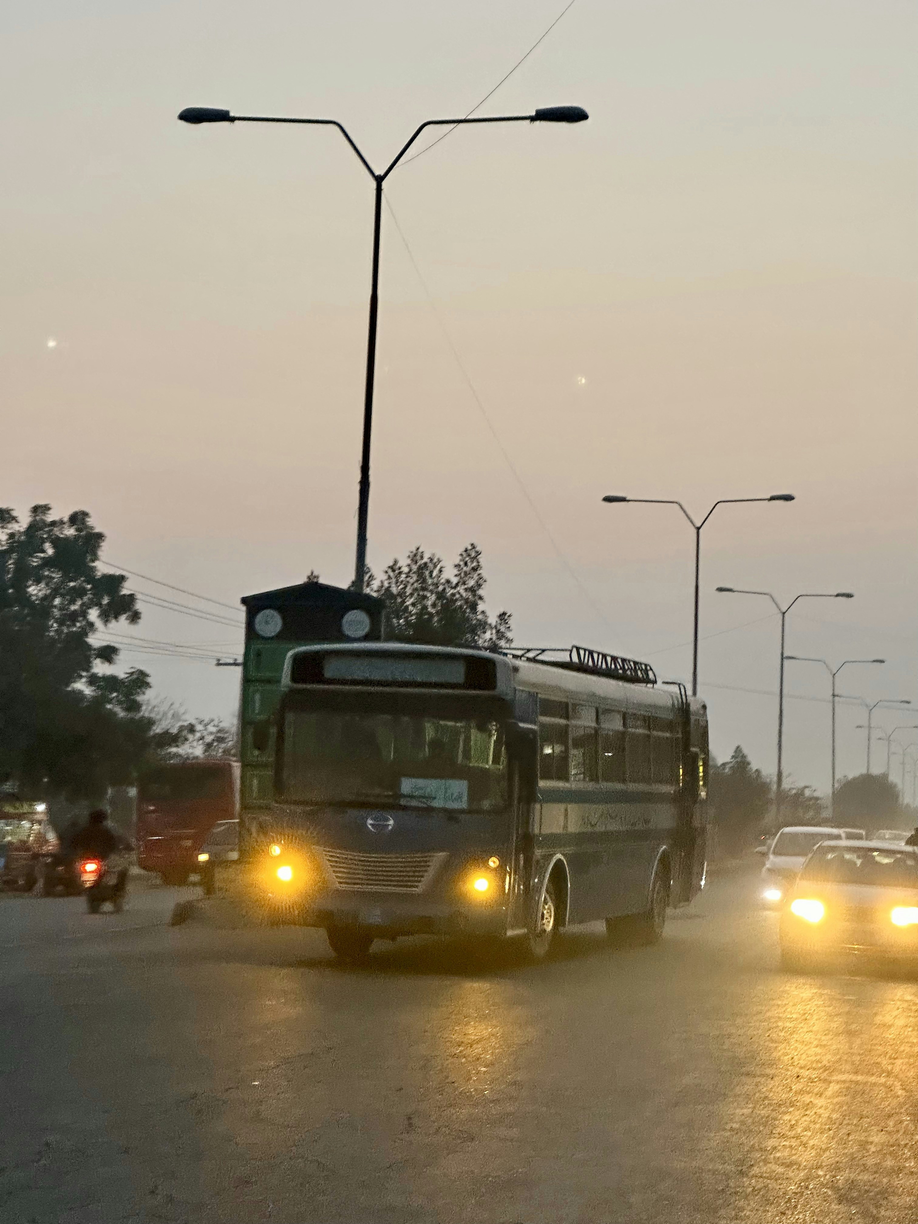 a bus and some cars on a city street