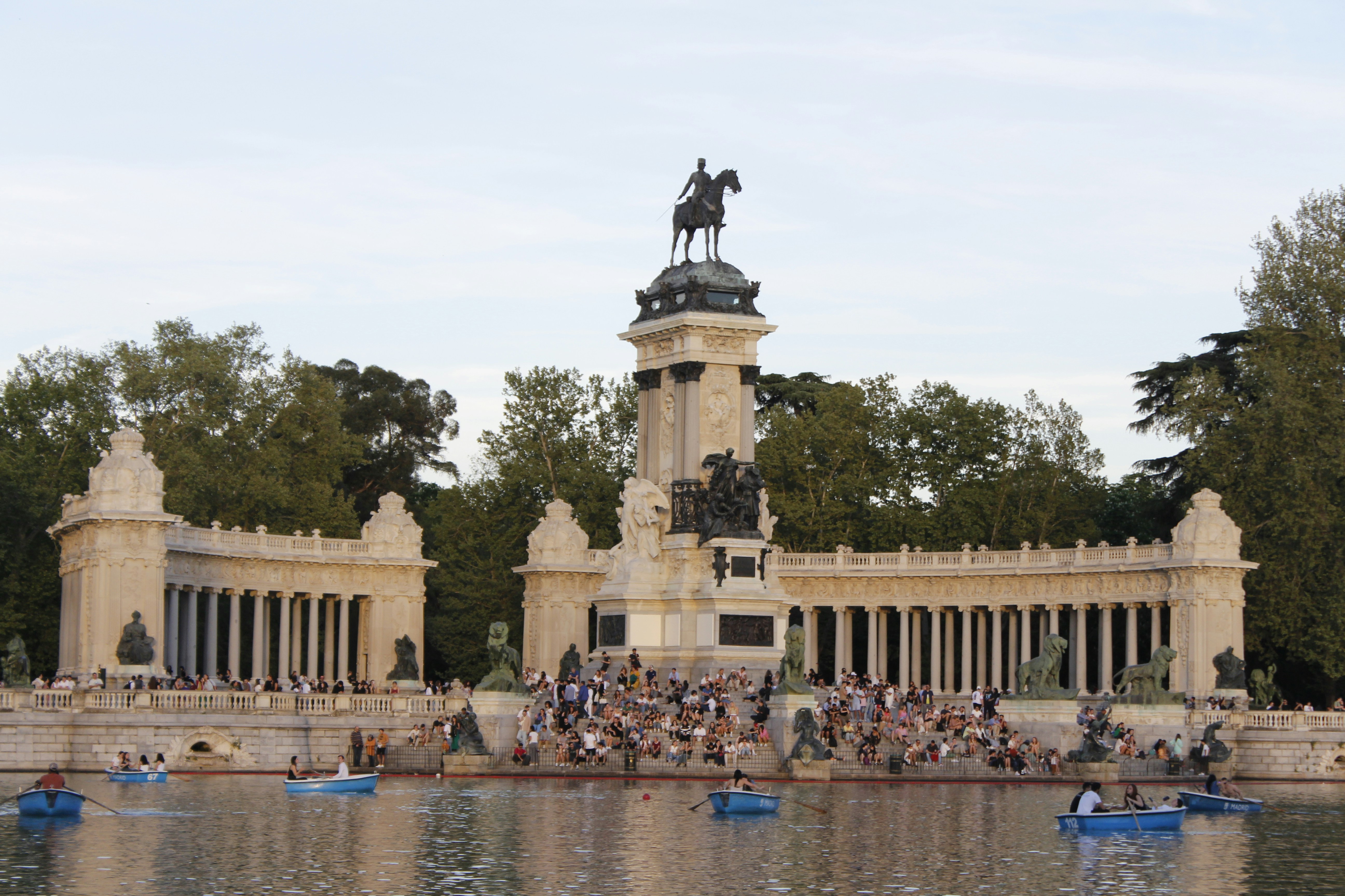 a statue of a man on a horse on top of a building