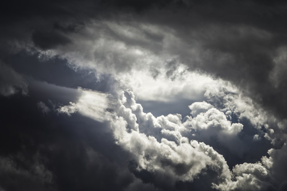 a black and white photo of clouds in the sky