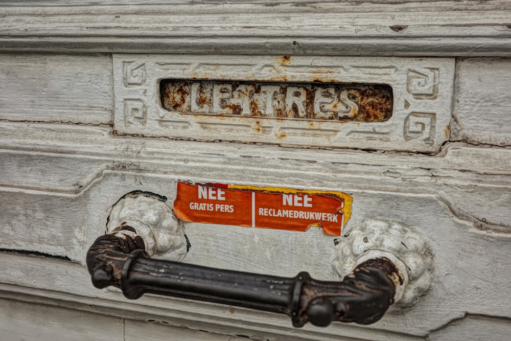 a close up of a metal object on the side of a building