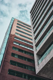 a very tall building next to a very tall building