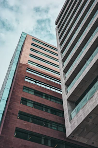 a very tall building next to a very tall building