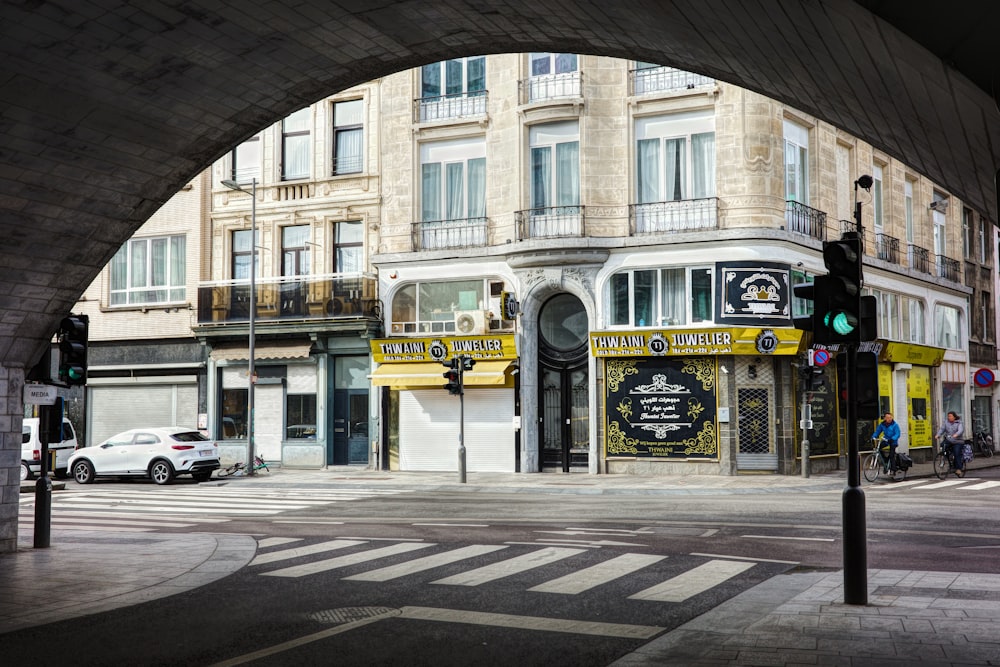 a view of a city street from under a bridge