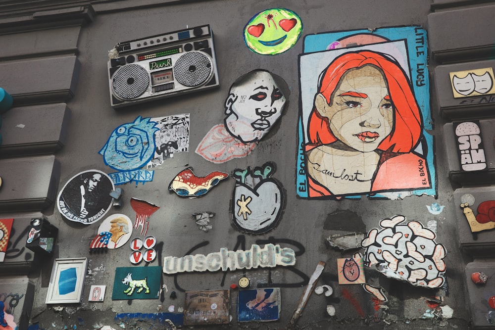 a bunch of stickers on the side of a building
