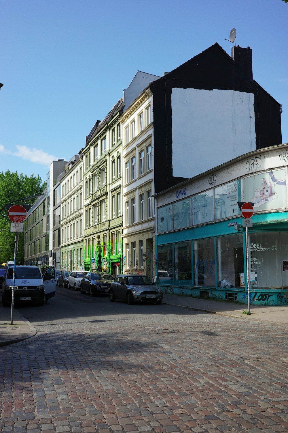 a city street with cars parked on the side of it