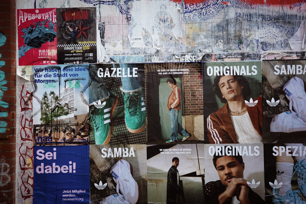 a collage of posters on the wall of a building