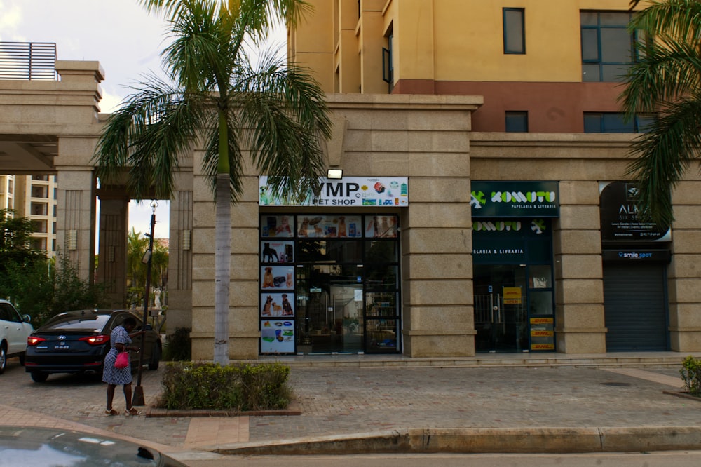 a couple of people that are standing in front of a building