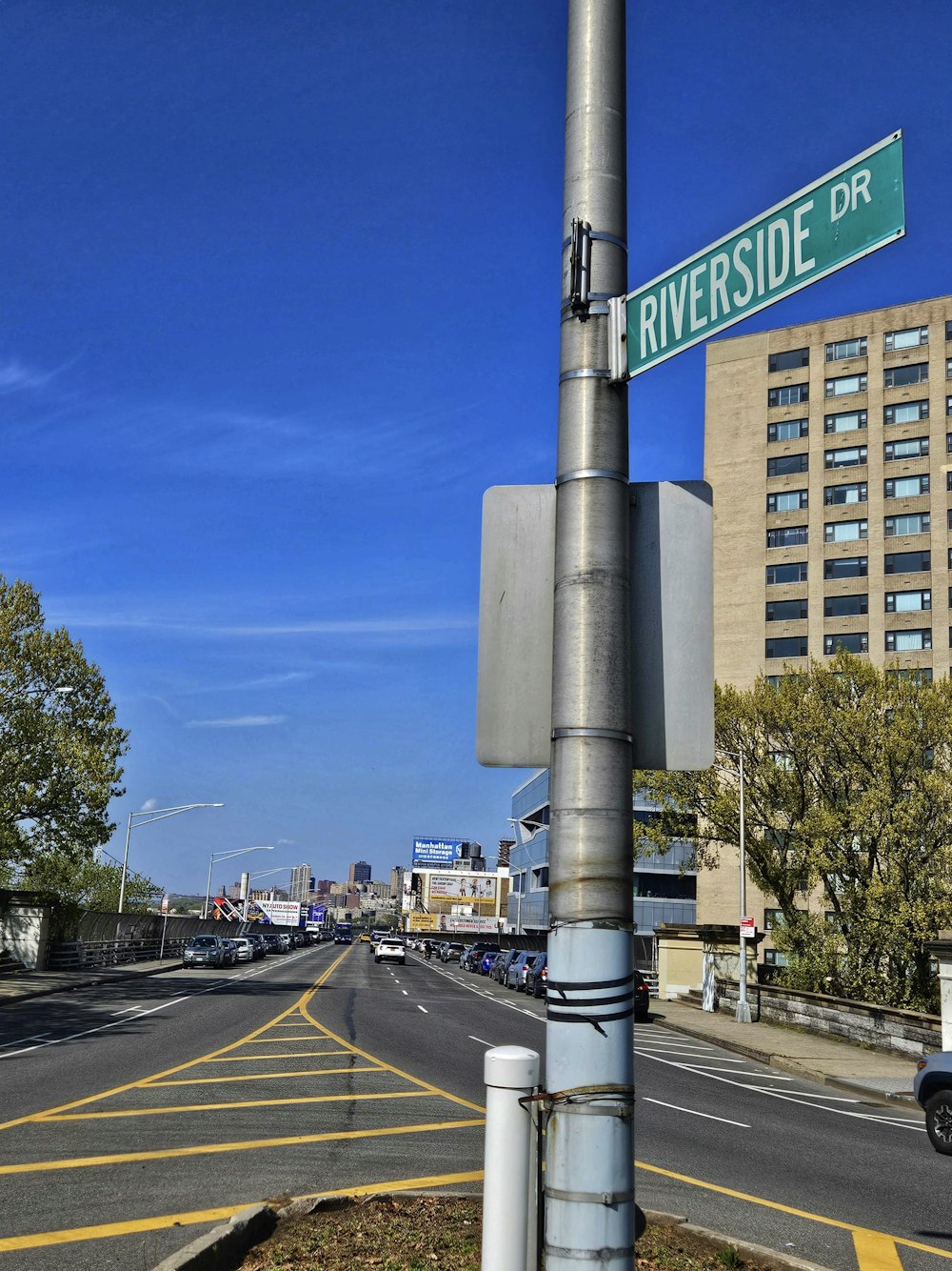 a street sign on a pole on the side of the road