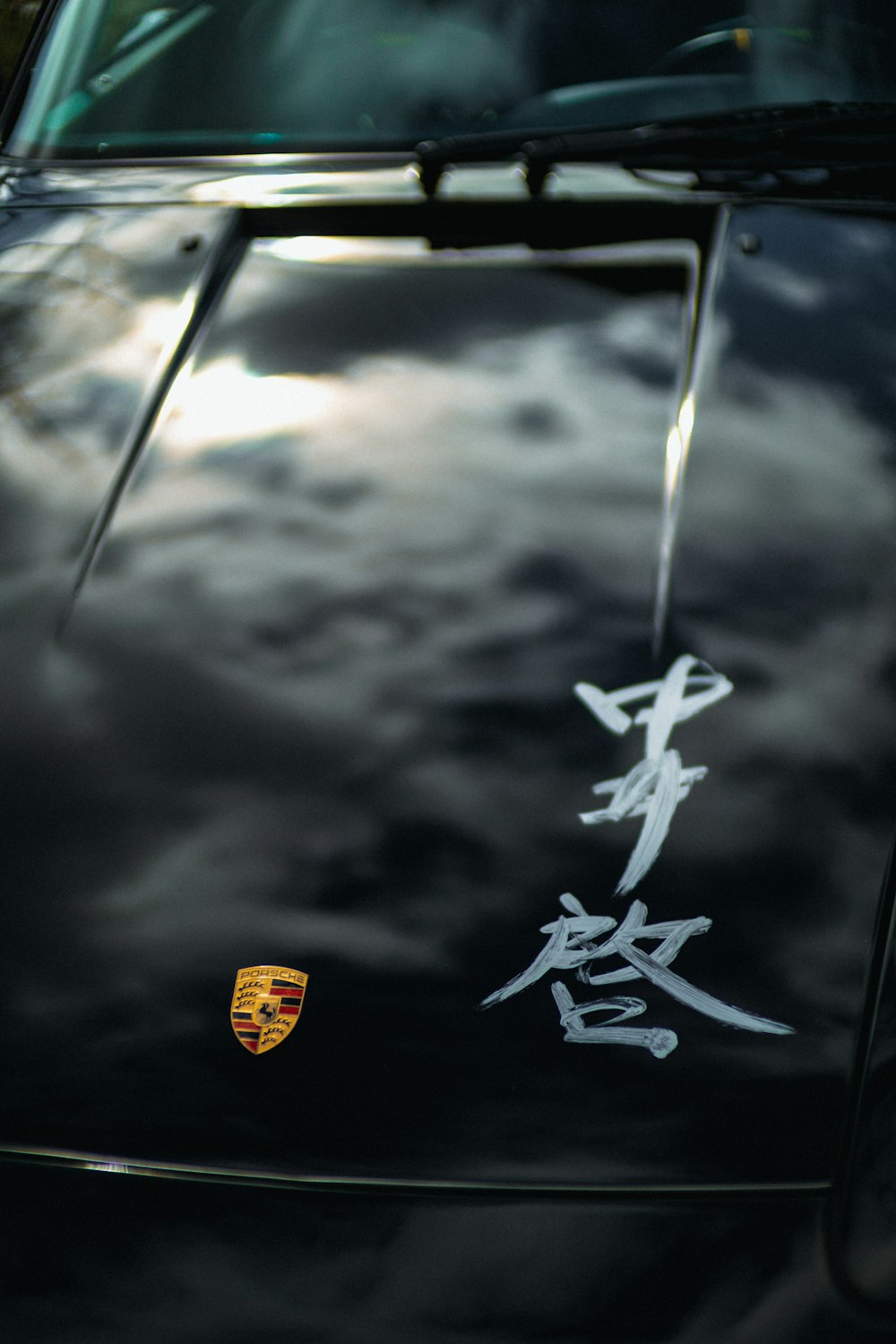 a black sports car with chinese writing on it