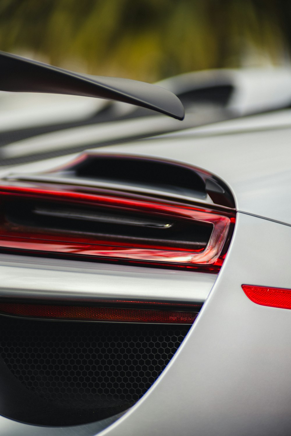 a close up of the tail lights of a sports car