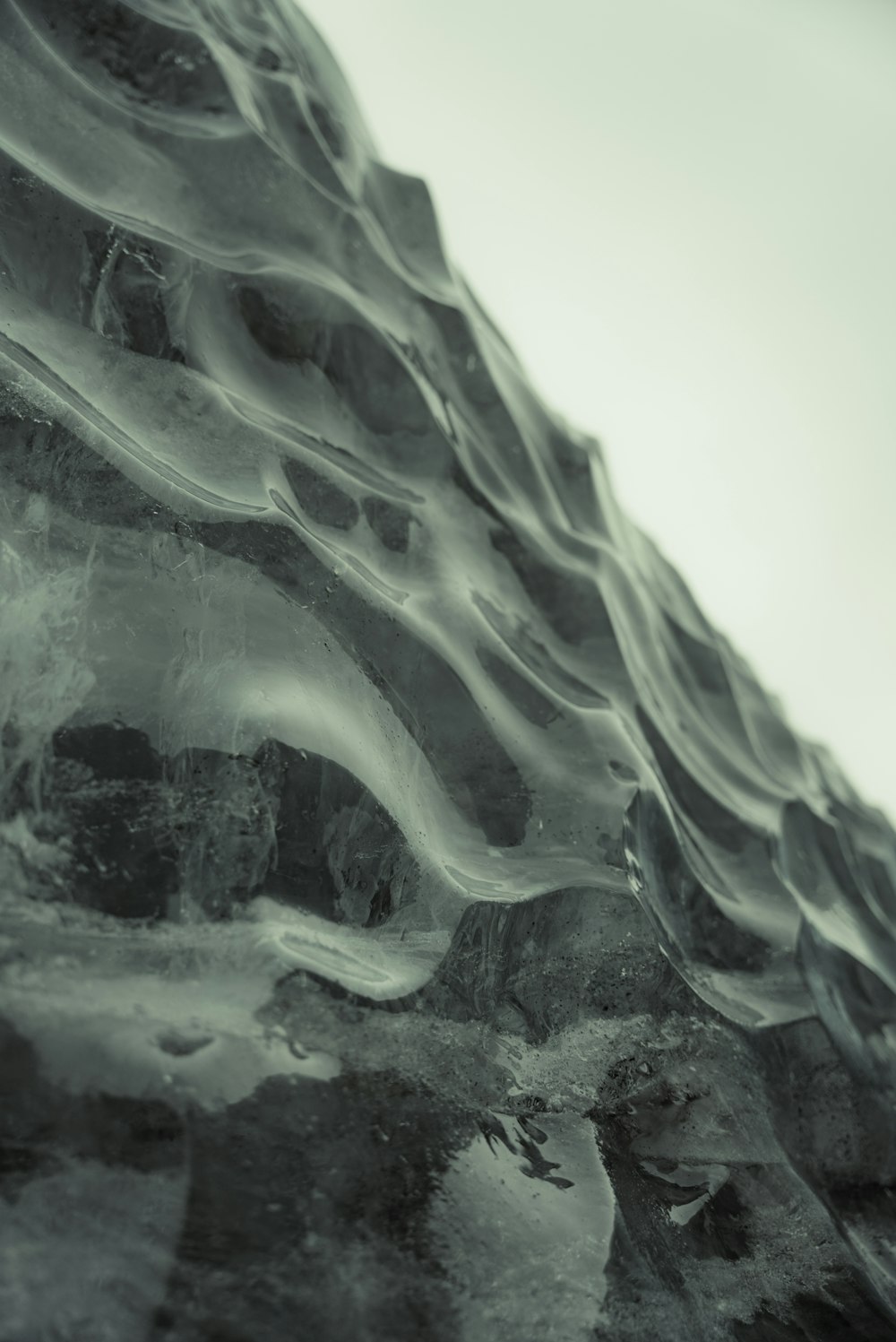 a black and white photo of a rock formation